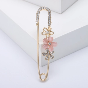 Elegant gold flower safety pin brooch with pink opal petals and sparkling rhinestones