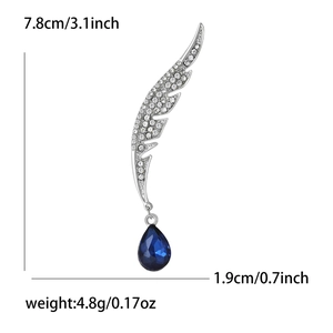 Broche élégante en forme d'aile avec cristal bleu et détails en diamants scintillants