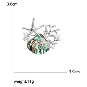 Elegant starfish and shell brooch with pearls and crystals, measuring 3.6cm by 3.9cm