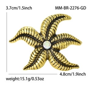 Golden starfish brooch for suits featuring wave texture and crystal center, 4.8cm wide