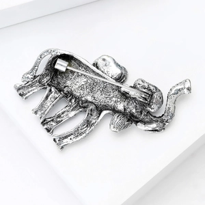Detailed back view of silver elephant brooch showing horizontal safety pin clasp detail