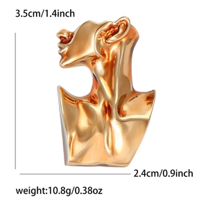 Minimalist abstract gold face brooch for women measuring 3.5cm by 2.4cm with mirror polish