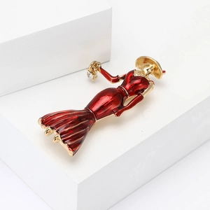 Elegant gold-tone enamel brooch with a red vintage lady design and sparkling rhinestone