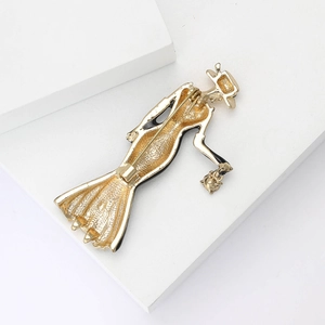 Detail view of vintage lady alloy brooch back showing the secure safety pin closure