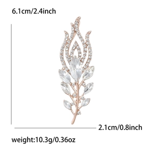 Detailed size view of elegant peacock feather brooch with crystals, 6.1cm by 2.1cm