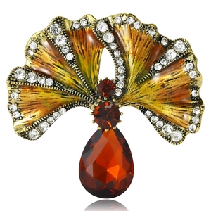 Vintage gold ginkgo leaf brooch with amber enamel, rhinestones and red teardrop pendant