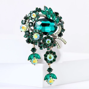 Vintage oversized emerald crystal brooch with green rhinestones and antique gold finish