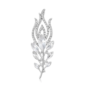 Elegant silver peacock feather brooch with sparkling rhinestones on white background