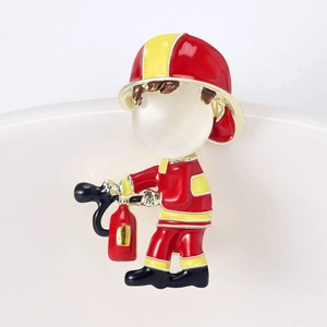 Cute firefighter brooch with red enamel and white pearl head on white ceramic edge