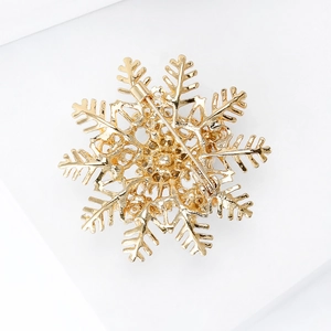 Elegant golden snowflake brooch with high-quality pearl and pin fastener back view
