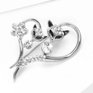 Detail of silver fox heart brooch with sparkling rhinestones and hollow-out design