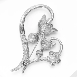 Detailed view of the silver metal brooch back with secure pin and anti-slip texture