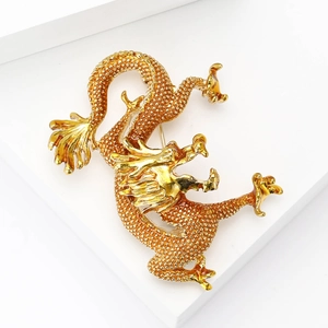 Majestic Chinese dragon brooch in gold metal with vibrant orange enamel and red accents