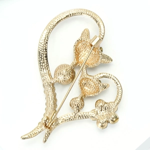 Detailed back view of gold fox brooch showing the secure safety pin locking mechanism