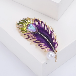 Vintage peacock feather brooch with colorful zircon, enamel finish, and white pearl accent