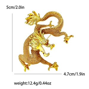 Golden enamel dragon brooch with scale texture and 5cm by 4.7cm size specifications