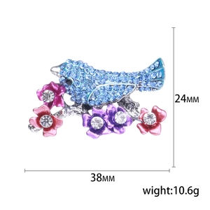 Exquisite bird brooch with blue crystals and enamel flowers on a branch for women