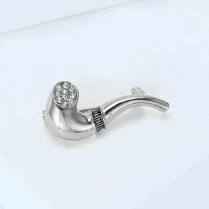 Detailed close-up of a silver pipe brooch featuring sparkling crystal rhinestones
