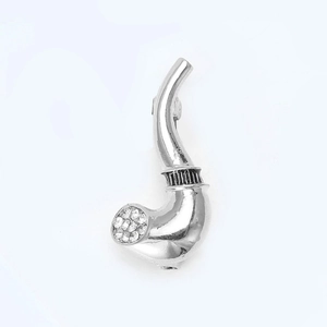 Detailed shot of silver pipe brooch with sparkling crystals and black textured stripe