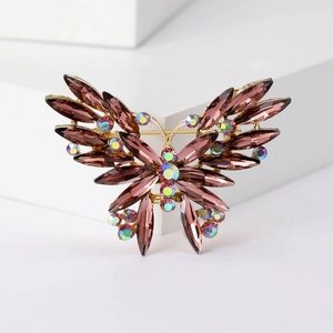 Detail of butterfly brooch with purple marquise crystals and gold-plated wings
