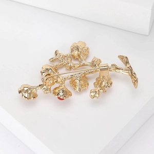 Vintage golden branch brooch with red pearl accent for suit jacket accessories