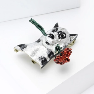 Detail of husky brooch with red rose on white stairs, enamel metal lapel pin craft