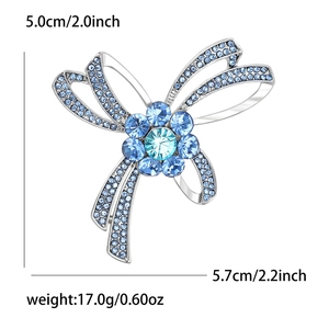 Élégante broche nœud en alliage argenté avec cristaux bleus et strass pour vêtements