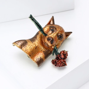 Detail view of German Shepherd enamel brooch with a red rose in its mouth and pin back