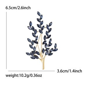 Elegant gold tree branch brooch with marquise blue crystals, size 6.5cm by 3.6cm