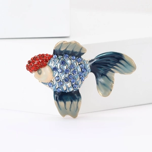 Elegant goldfish brooch with blue rhinestones and gradient enamel on white display block