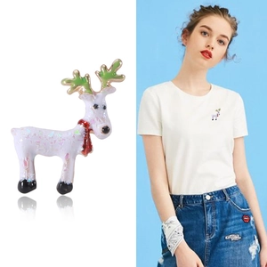 Sparkly Christmas deer brooch with colorful sequins and green antlers for holiday outfits
