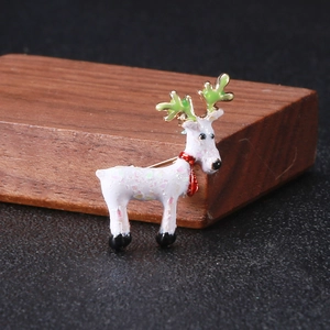 Detailed view of Christmas deer brooch with colorful sequins and festive enamel finish