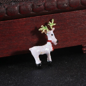 Macro view of cartoon reindeer brooch with shiny colorful sequins and alloy oil drip finish