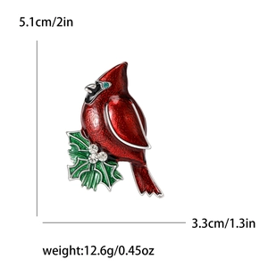 Red enamel cardinal bird brooch with green leaves and dimensions 5.1cm by 3.3cm