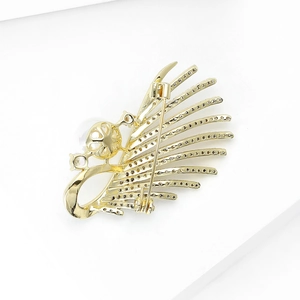 Detailed back view of a bird brooch showing the secure rotating gold-plated metal pin clasp