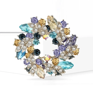 Elegant silver flower brooch featuring multi-color Czech crystals and floral wreath design