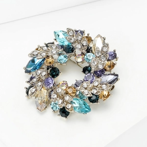 Elegant floral wreath brooch with colorful rhinestones and crystals on silver finish