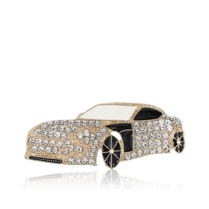 Elegant gold-tone car brooch with sparkling rhinestones and black enamel accents