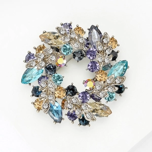 Elegant floral brooch with multicolored crystals and silver alloy base for formal wear