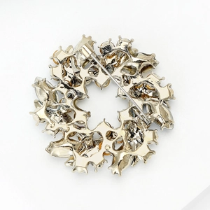 Elegant golden floral wreath brooch with secure safety pin and intricate back details