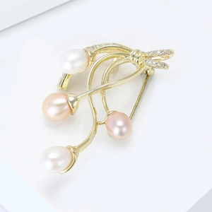 Elegant gold bow brooch with four multicolored freshwater pearls and zircon inlay
