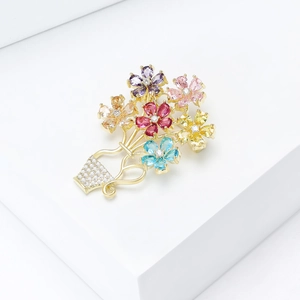 Detailed close-up of a golden flower basket brooch with colorful cubic zirconia stones