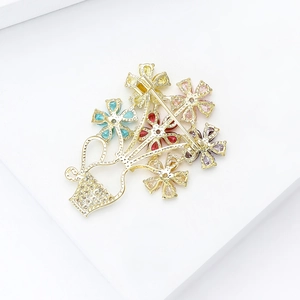 Elegant gold flower basket brooch with colorful zircons and secure safety pin clasp