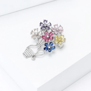 Detail of flower basket brooch with colorful pear-cut zircons and silver plating