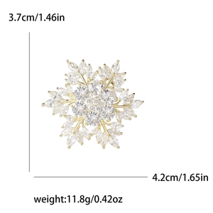 Elegant snowflake zirconia brooch for women with gold frame measuring 3.7cm by 4.2cm