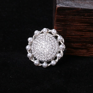 Vintage zircon sunflower brooch with pearls on silver base over black velvet