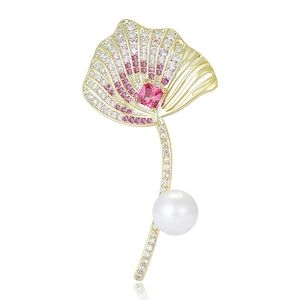 Elegant gold ginkgo leaf brooch with pink cubic zirconia and a round white pearl charm