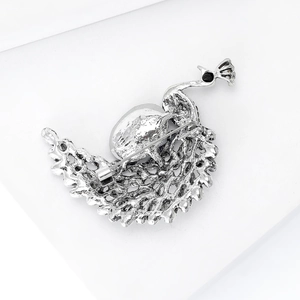 Exquisite silver peacock brooch with navy crystal details and intricate hollowed pattern
