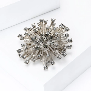 Sparkling starburst brooch with crystals for elegant evening wear and luxury suits