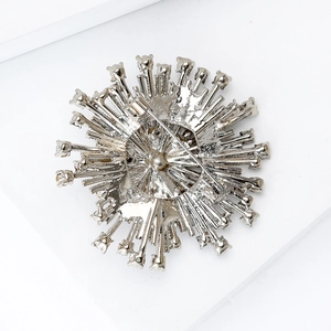 Back view of silver starburst brooch with pin clasp and sparkling Czech crystal detail